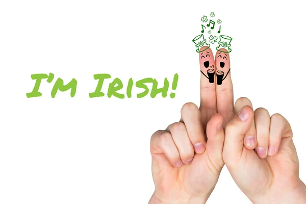 Composite image of patricks day fingers — Stock Photo, Image