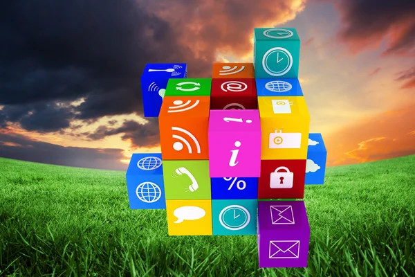 Colorful App cube against green field — Stock Photo, Image