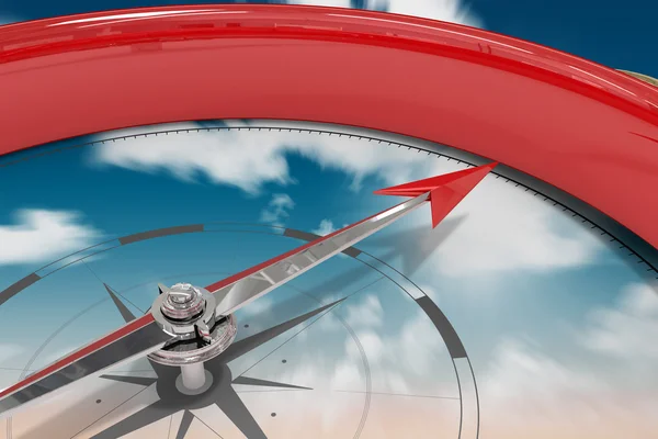 Del av röd kompass mot himlen — Stockfoto