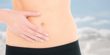 Closeup mid section of a fit woman with stomach clipart
