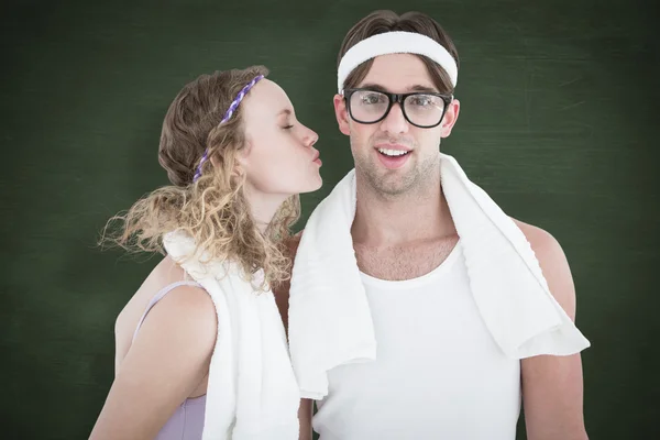 Geeky hipster kissing her boyfriend — Stock Photo, Image