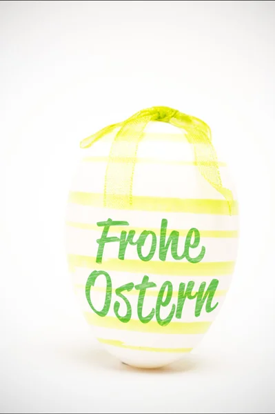 Frohe ostern against easter egg — Stock Photo, Image