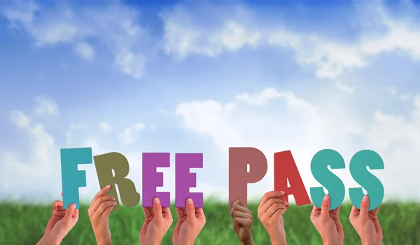 Composite image of hands holding up free pass — Stock Photo, Image
