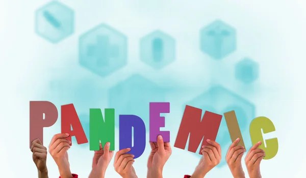 Composite image of hands holding up pandemic — Stock Photo, Image