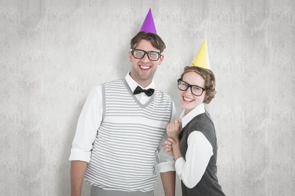 Comedy image of happy geeky hipster pour with party hat — стоковое фото