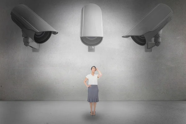 Composite image of thoughtful businesswoman — Stock Photo, Image