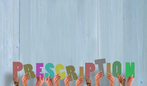 Composite image of hands holding up prescription — Stock Photo, Image