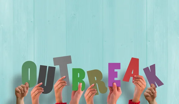 Composite image of hands holding up outbreak — Stock Photo, Image