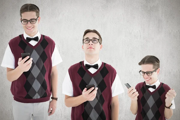 Composite image of nerd with smartphone — Stock Photo, Image