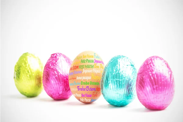 Happy easter against four easter eggs — Stock Photo, Image