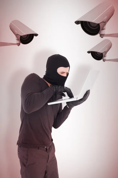 Hacker using laptop to steal identity — Stock Photo, Image