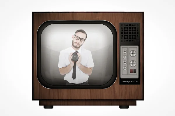 Geeky businessman holding alarm clock — Stock Photo, Image