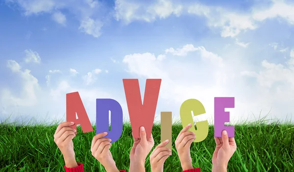Composite image of hands holding up advice — Stock Photo, Image