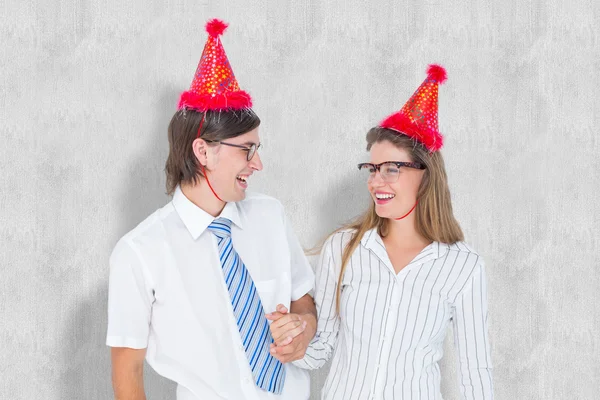 Happy geeky hipster couple with party hat — Stock Photo, Image