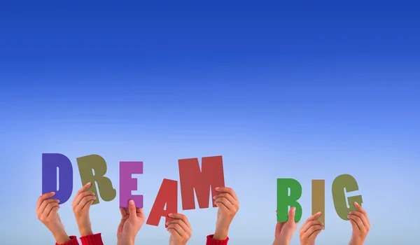 Composite image of hands holding up dream big — Stock Photo, Image