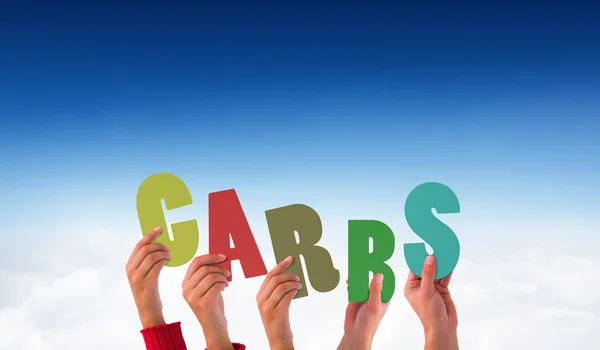 Imagen compuesta de manos sosteniendo carbohidratos — Foto de Stock