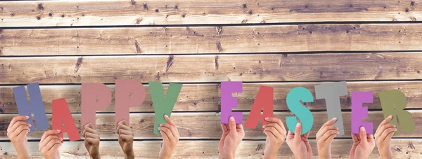 Manos levantando feliz Pascua — Foto de Stock