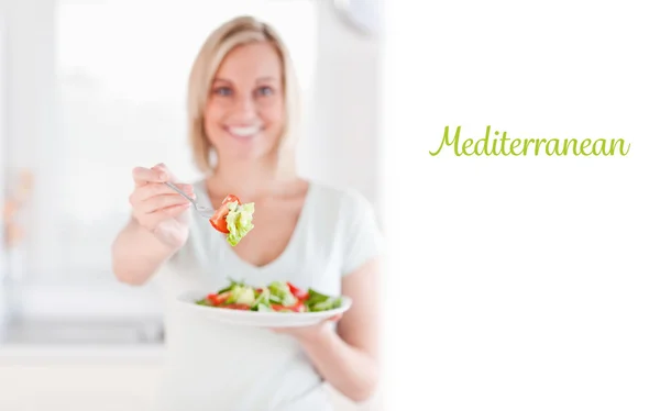 Mediterranean against woman offering salad — Stock Photo, Image