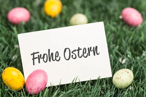 Composite image of frohe ostern — Stock Photo, Image