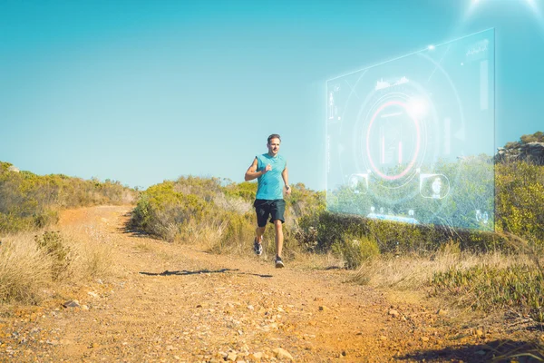 Homme athlétique jogging sur piste de campagne — Photo