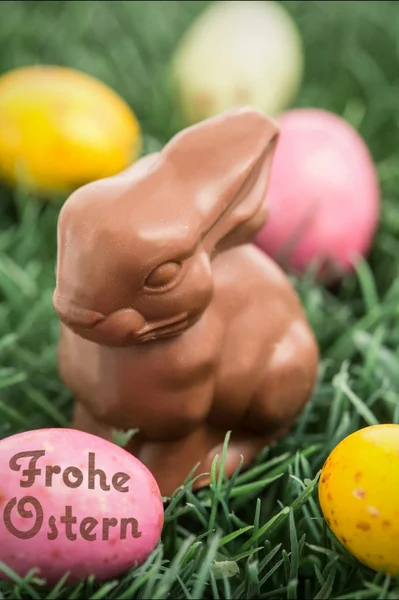 Frohe ostern against easter eggs — Stock Photo, Image