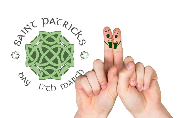 Composite image of patricks day fingers — Stock Photo, Image