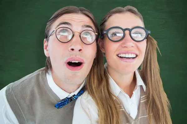 Geeky hipster couple raising eyes — Stock Photo, Image