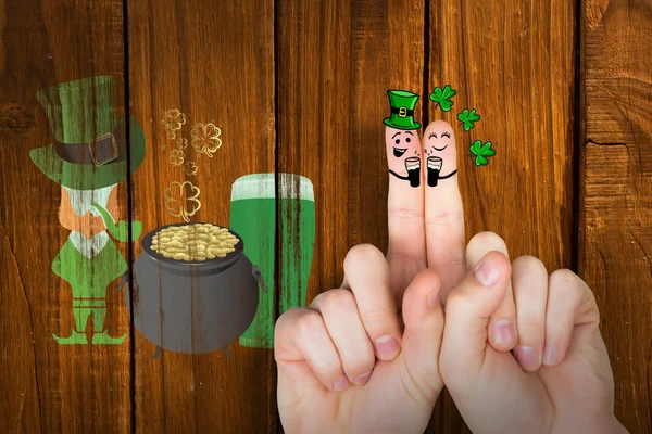 Composite image of patricks day fingers — Stock Photo, Image