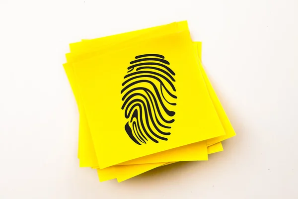 Fingerprint against sticky note — Stock Photo, Image