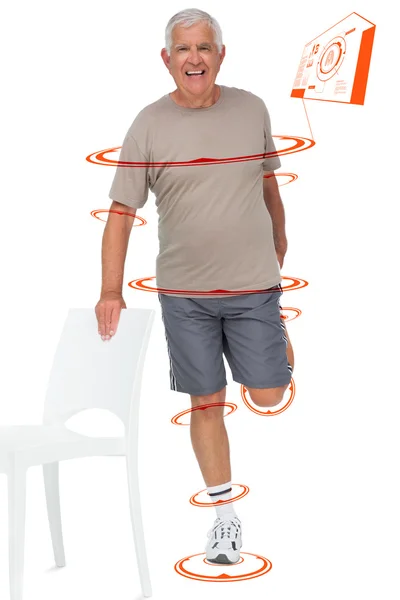 Happy senior man stretching leg — Stock Photo, Image