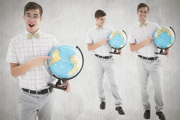 Composite image of nerd with globe — Stock Photo, Image