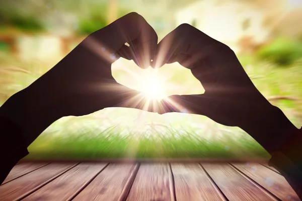 Woman making heart shape with hands — Stock Photo, Image