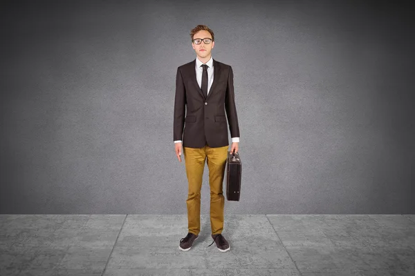 Young geeky businessman holding briefcase — Stock Photo, Image