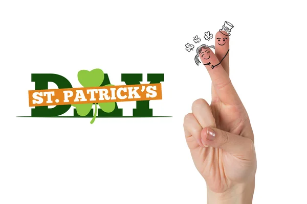 Composite image of patricks day fingers — Stock Photo, Image