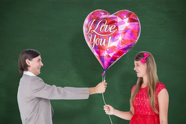 Geeky hipster ofreciendo globo en forma de corazón rojo —  Fotos de Stock