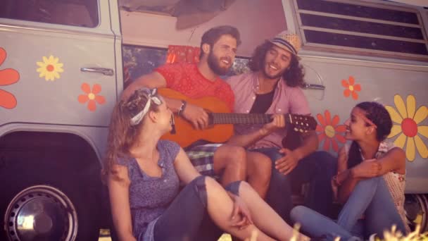 Friends sitting by their camper van — Stock Video