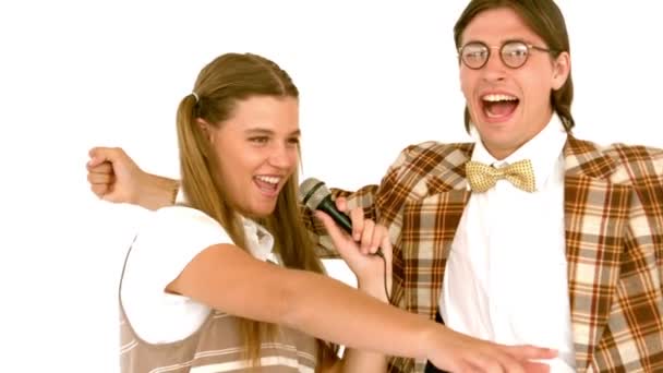 Geeky hipsters singing with microphone — Stock Video