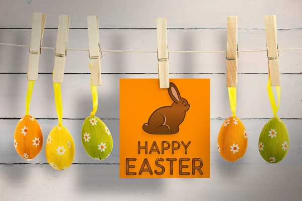 Happy Easter greeting against wooden planks — Stock Photo, Image