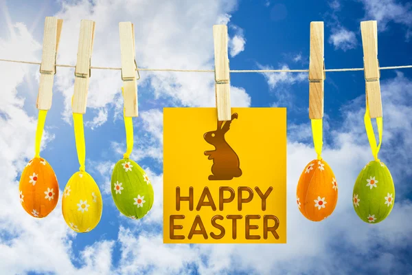 Happy easter graphic against blue sky — Stock Photo, Image