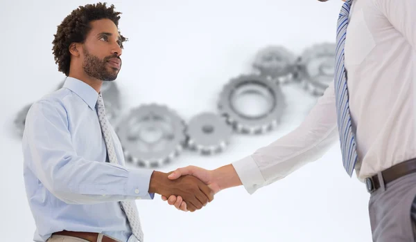 Young businessmen shaking hands — Stock Photo, Image