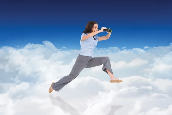 Cheerful classy businesswoman jumping — Stock Photo, Image