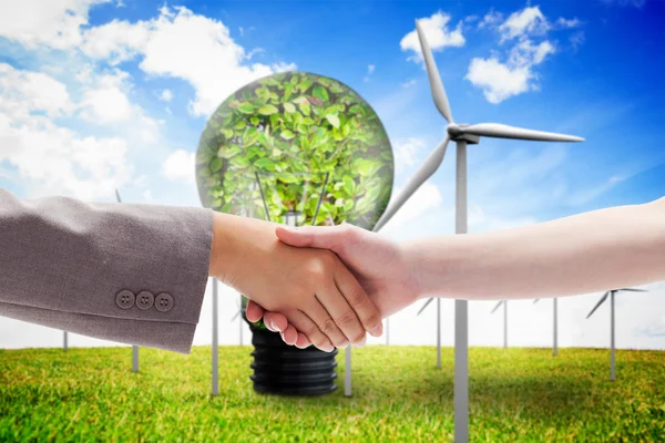 Composite image of handshake between two women — Stock Photo, Image