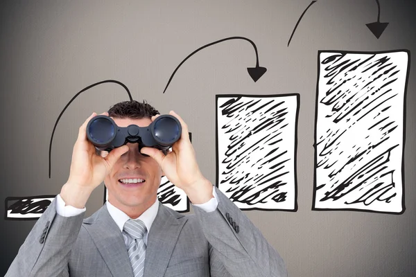 Businessman holding binoculars — Stock Photo, Image