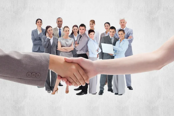 Two women against business team — Stock Photo, Image