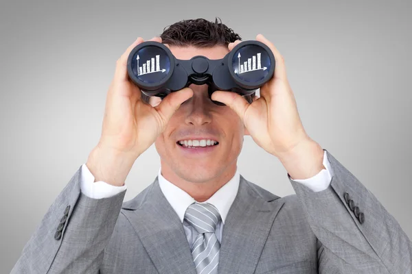 Businessman holding binoculars — Stock Photo, Image
