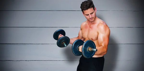 Bodybuilder lifting dumbbells — Stock Photo, Image