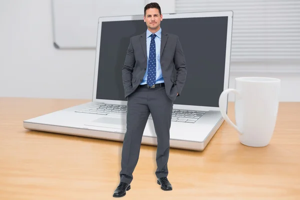 Thinking businessman against computer — Stock Photo, Image