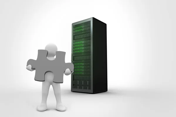 Character holding jigsaw piece against server tower — Stock Photo, Image