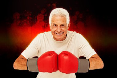 Senior man in boxing gloves clipart