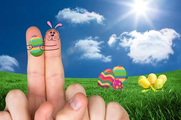 Finger als Osterhase gegen Wolken — Stockfoto